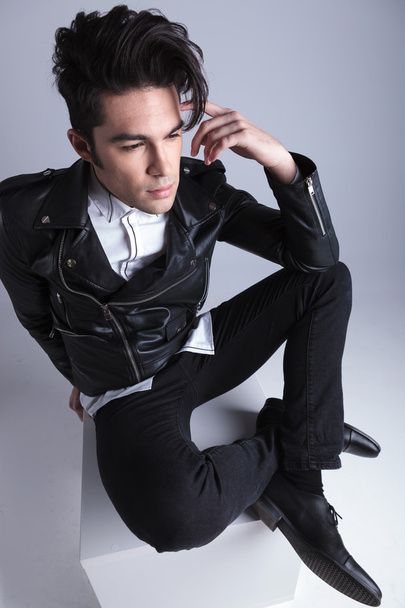 Up view of a young fashion man sitting - Photo, Image