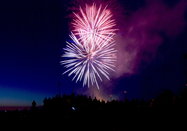 Two Firework Burst With Crowd At Night - Photo, Image