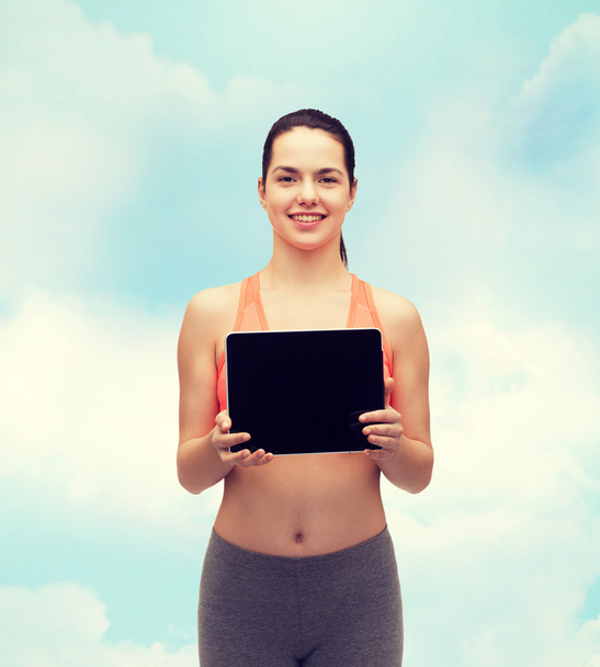 sporty woman with tablet pc blank screen - Foto, imagen