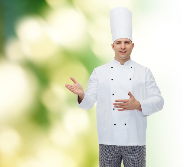 happy male chef cook inviting - Foto, afbeelding