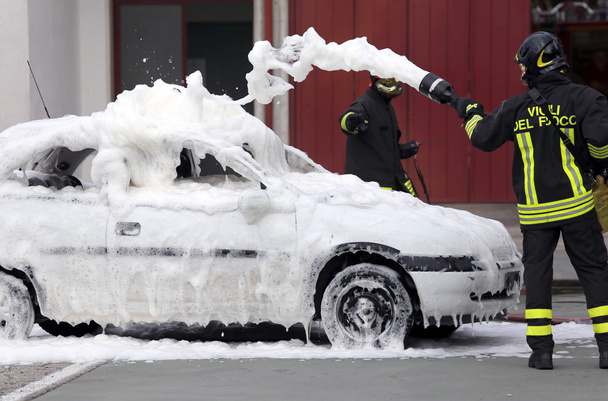 firefighters during exercise to extinguish a fire in a car - Photo, Image