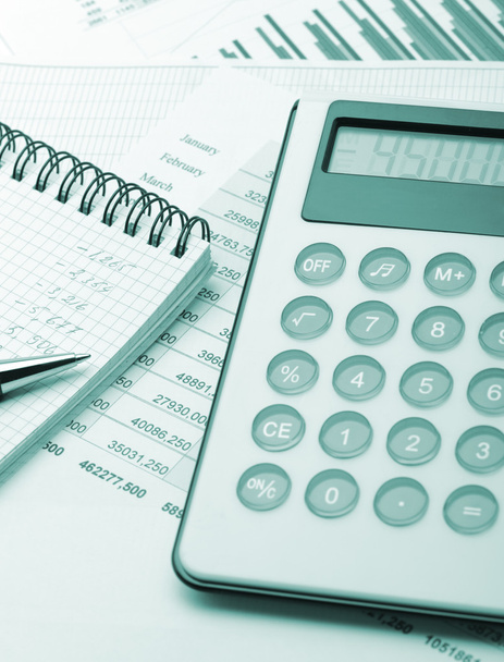 The calculator and the financial report blue toned - Fotó, kép