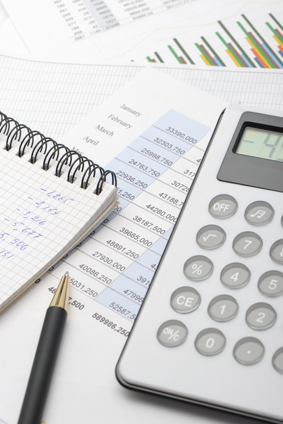 The calculator and the financial report blue toned - Foto, immagini