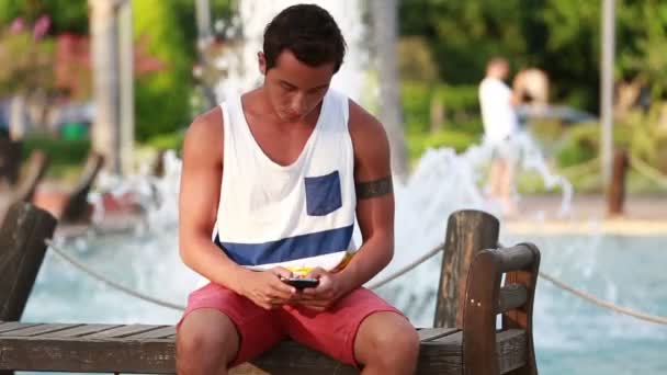 attractive young boy texting message - Footage, Video