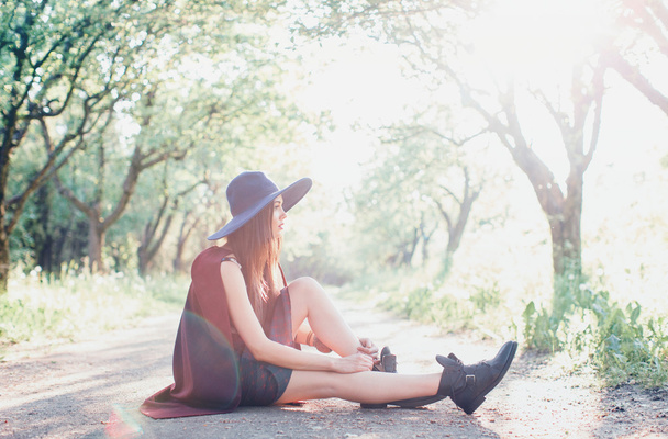 fashion girl sitting on ground - Photo, image