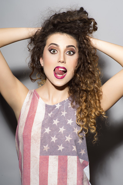 Crazy girl in american flag printed shirt - Fotó, kép