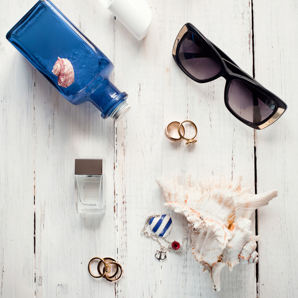 Set of summer accessories set with seashells on white wooden bac - Φωτογραφία, εικόνα