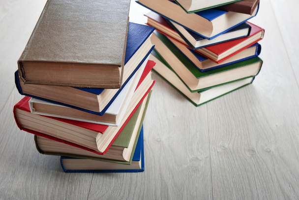 Stacks of books on wooden background - Foto, Imagem