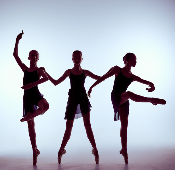 Composition from silhouettes of three young ballet dancers - Fotografie, Obrázek
