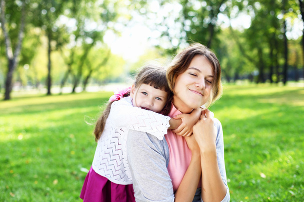Mother and daughter in park - Photo, image