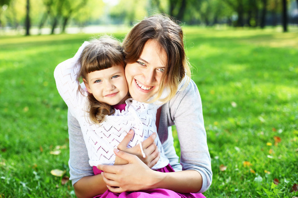 Mother and daughter in park - Photo, Image