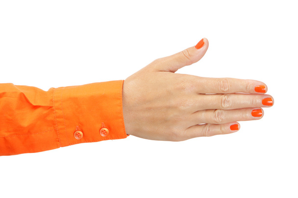 Γυναικείο χέρι σε πορτοκαλί πουκάμισο - Φωτογραφία, εικόνα