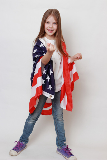 Adorable little girl and American flag - Zdjęcie, obraz