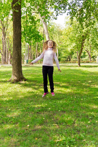 Jumping girl in summer - Photo, image