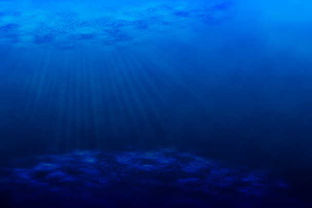 An underwater scene with sun rays shining through the water's gl - Foto, Bild