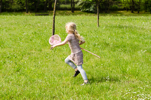 girl catching butterfly - Photo, Image