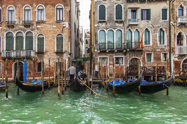 VENICE, ITALY - on APRIL 30, 2015. Typical urban view. The coast of the Grand channel (Canal Grande) and gondolas. The grand channel is the main transport artery of Venice and its most known channel - 写真・画像