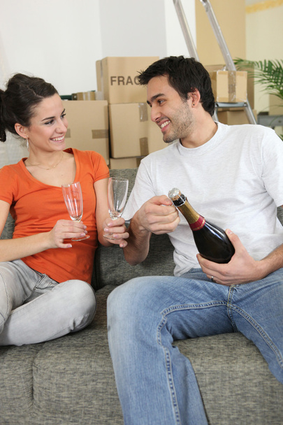 Couple drinking champagne at home - Photo, image