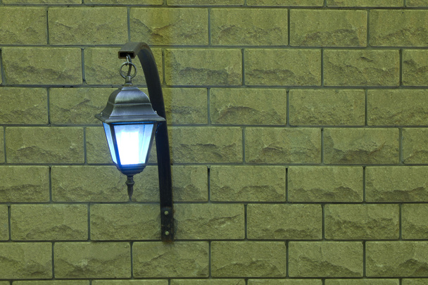 the lamp on a brick wall on the left - Photo, Image