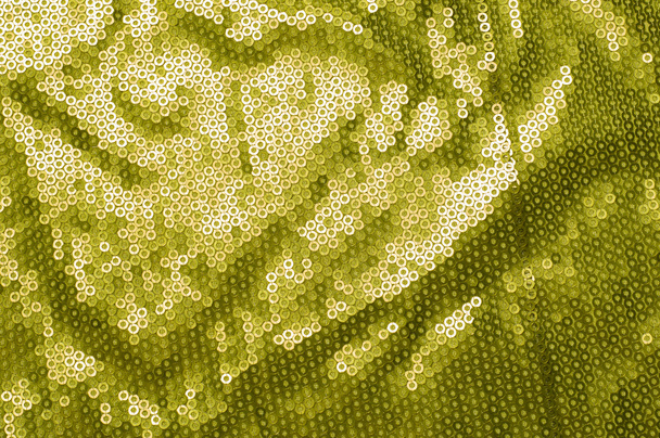Tekstura tkanina z zielonego cekinów. małe, błyszczący dysk szyte jako jeden z wielu na odzież ozdoba - Zdjęcie, obraz
