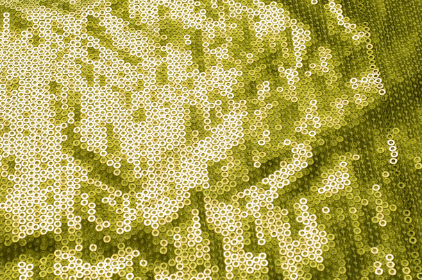 Textura de tecido com lantejoulas verdes. um pequeno disco brilhante costurado como um dos muitos em roupas para decoração
 - Foto, Imagem