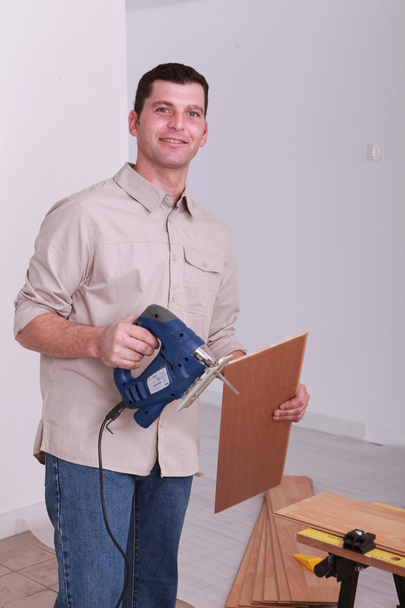 Portrait of a man sawing - Фото, зображення