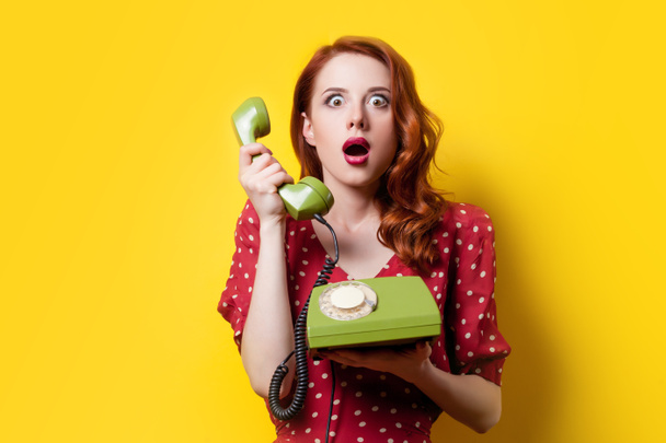 Girl in dress with green dial phone - Foto, Bild