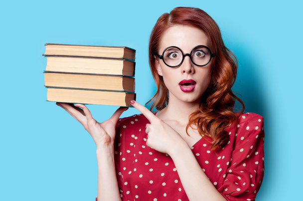 girl in red dress with books - Foto, Imagem