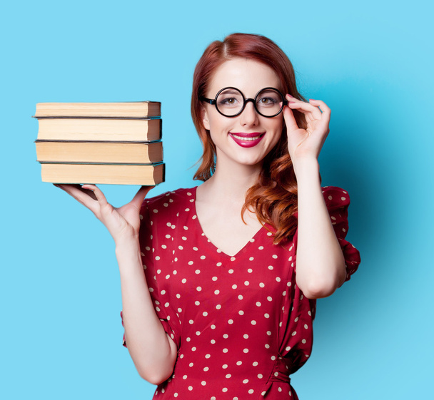 girl in red dress with books - Photo, Image