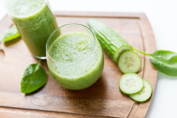 close up of fresh green juice glass and celery - Fotó, kép