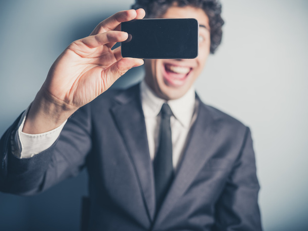 Businessman taking a selfiie - Фото, зображення