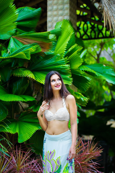Young beautiful woman in a hotel in a tropical island. Summer va - Photo, image