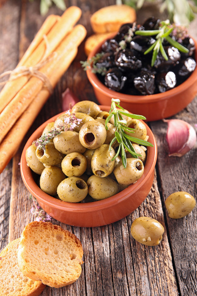 lack and green Olives with herb - Fotó, kép