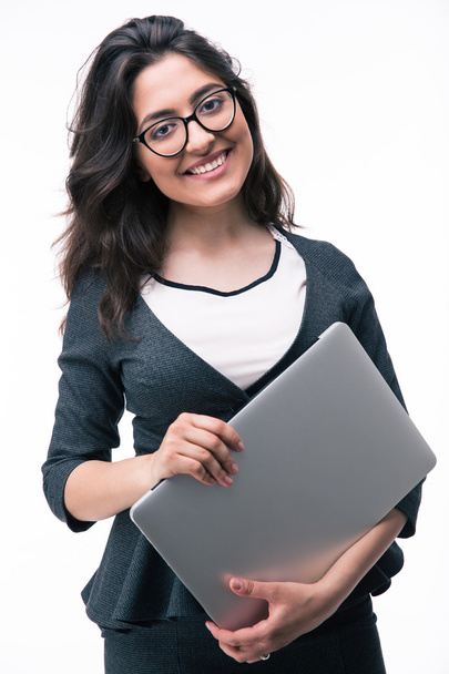 Smiling businesswoman holding laptop - Фото, изображение