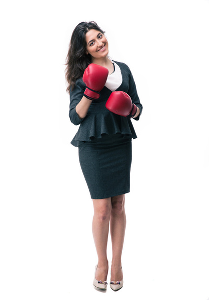 Happy businesswoman standing in boxing gloves - Foto, afbeelding