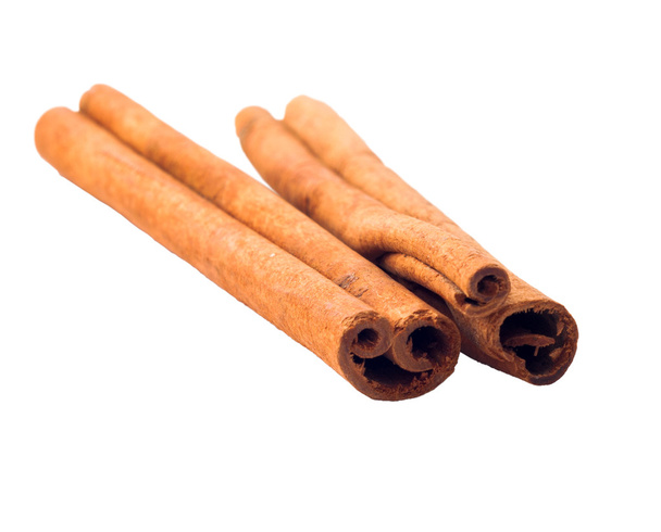 two cinnamon sticks closeup on a white background - Photo, Image