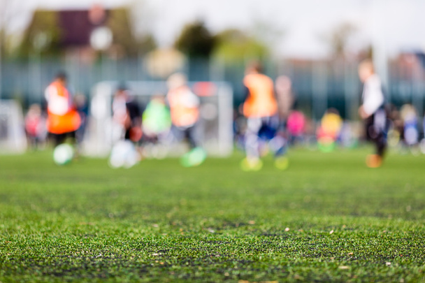 Blur of young boys playing soccer match - 写真・画像