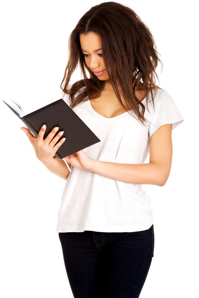 Young student woman reading book. - Foto, immagini