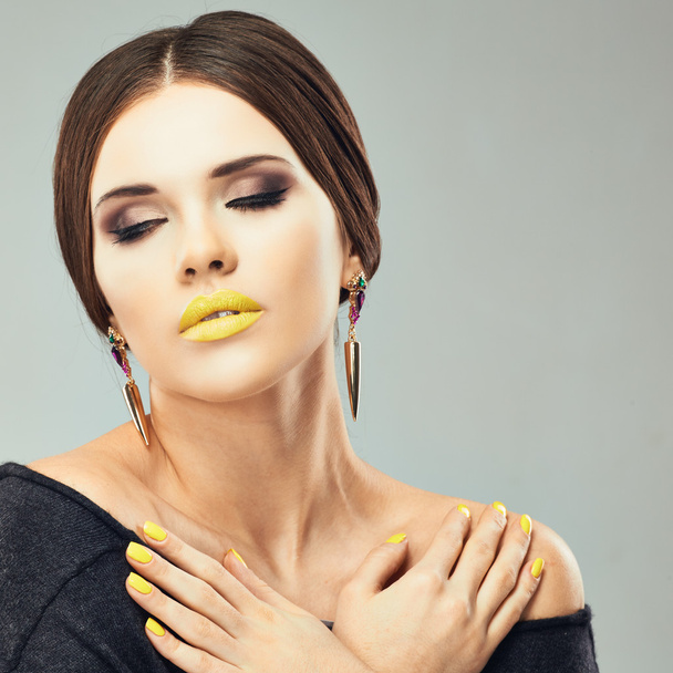 Woman with yellow lips and nails - Фото, изображение