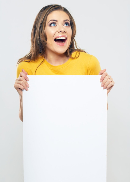 Woman holding blank poster - Foto, imagen