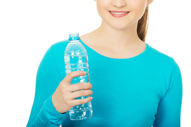 Beautiful woman with bottle of mineral water. - Fotoğraf, Görsel