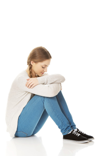 Depressed teen woman sitting. - Fotó, kép