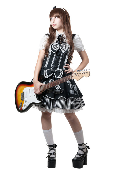Cosplay girl in black dress with guitar - Photo, image