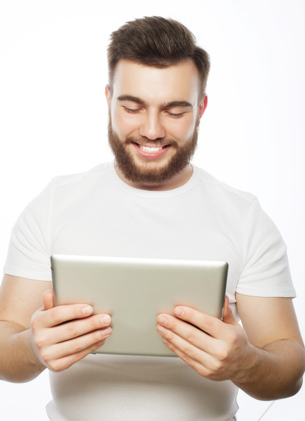 young man  using a tablet computer  - Фото, изображение