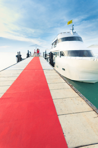 Yacht docking at the pier with red carpet to party - Fotoğraf, Görsel