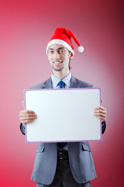 Businessman with santa hat and message - Фото, зображення