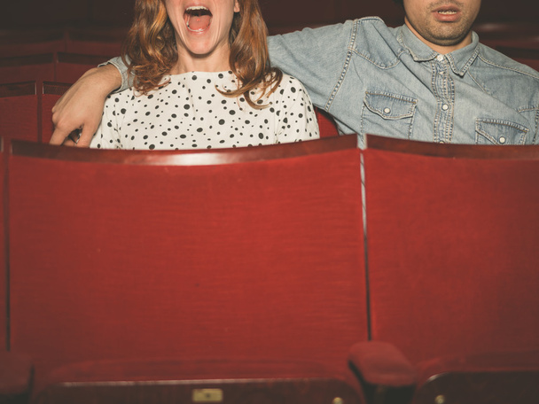 Couple watching a film in a movie theater - Фото, изображение