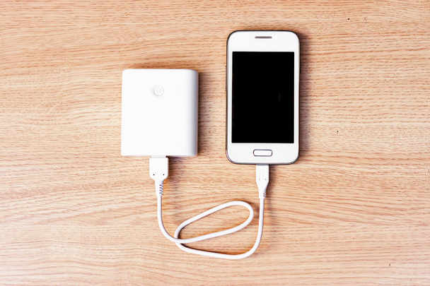 smartphone with a power bank charger - Photo, Image