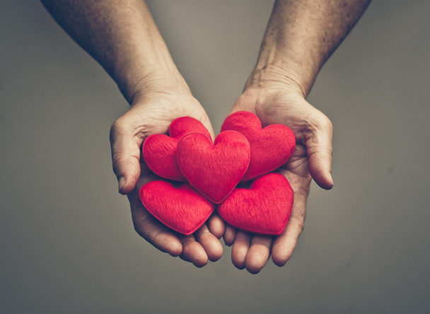 Hands holding red hearts - Fotó, kép