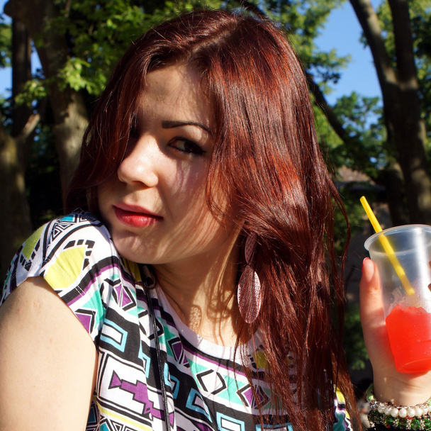 Young lady eating slush in the park - Foto, Imagen